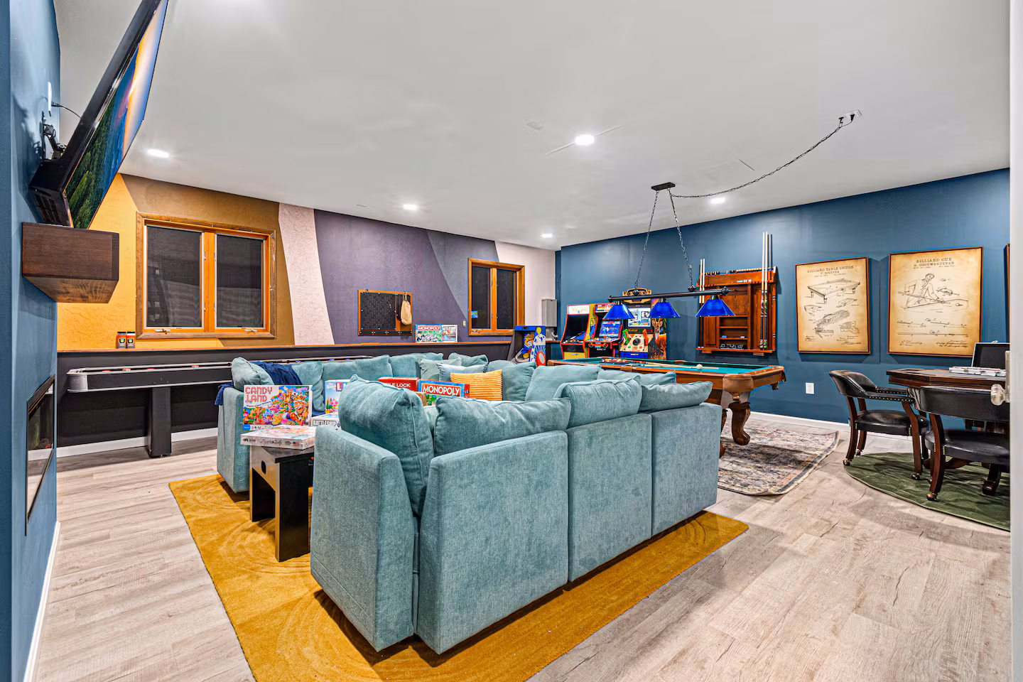 Game room with pool table and arcade machines