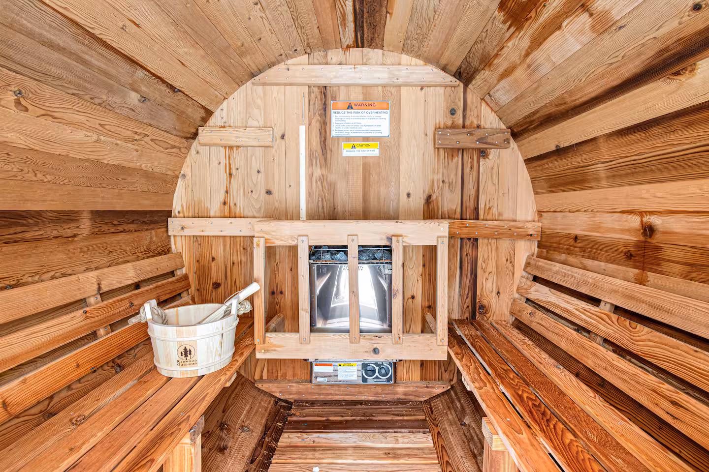 Cedar sauna interior with steam and wooden benches